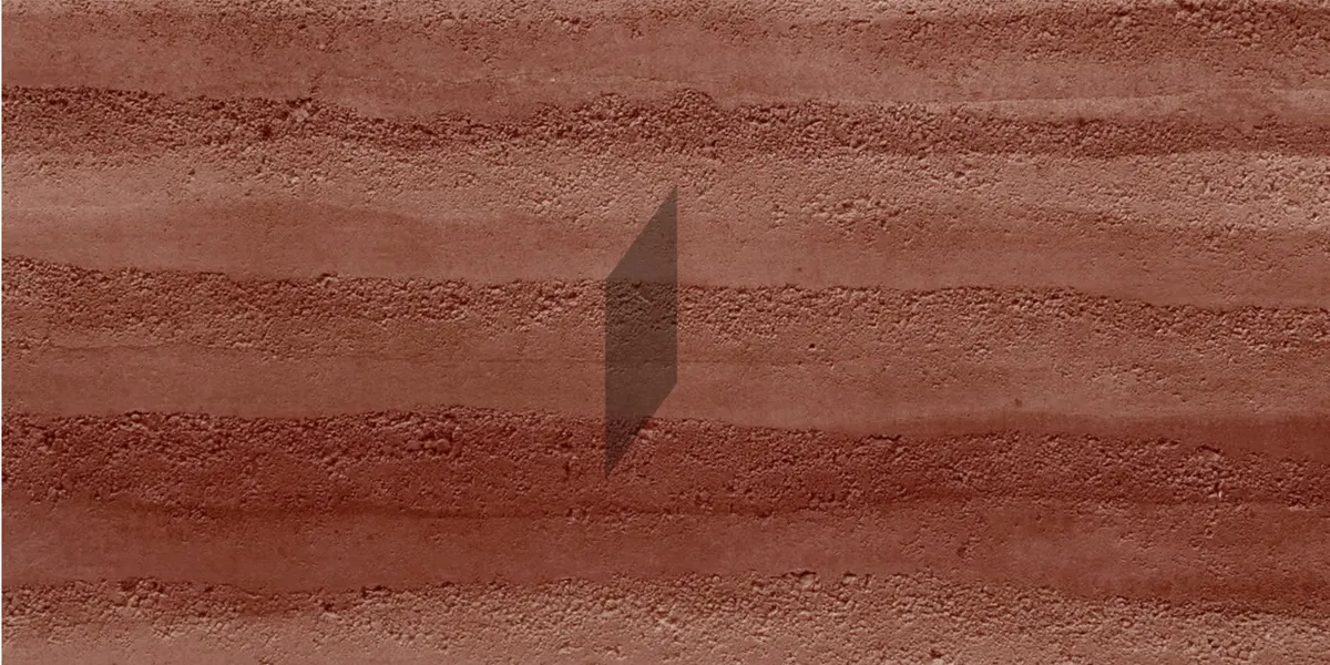 Muro de lectura de tierra apisonada en un paño de muestra